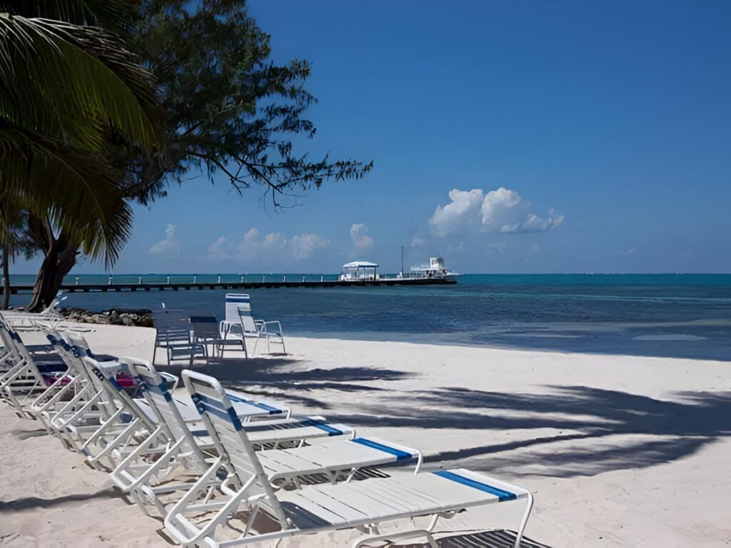 Get away from it all at "Rum and Kai", located at the Retreat in Rum Point. This beach front 1 bedroom condo is located in the stunning upscale vacation home enclave of Cayman Kai on beautiful Grand Cayman. Completely renovated in 2003 with further updates in 2009, this 3rd floor unit is fully equipped with everything you will need for a relaxing beach front vacation. The unit is tastefully decorated with high-end furnishings and the finest linens; all in an understated, yet elegant tropical West Indies motif. Featuring breathtaking beach and ocean views from the fully screened lanai and just steps from both the quiet pool and sandy white beach (fantastic for both swimming and snorkeling). The beach features both Palm and Casuarina trees for ample shade. Rum and Kai is the perfect size (1,039 sq. ft) for couples or a small family looking for a truly stress-free beach holiday. Within walking distance to a pier, you are just minutes from the famous Sting Ray City and Cayman's renowned North Wall, also making Rum & Kai an ideal base for a Dive vacation. With a king size bed, queen size sofa bed and twin pull out bed, Rum and Kai provides ample sleeping options. The fully equipped kitchen and available BBQ grills makes dining-in as easy as if you are home. But, since you are on vacation there are numerous restaurants located nearby. Conveniently next door is the popular Rum Point Club, featuring: restaurants, the Wreck bar, gift shop, water sports and snorkel rentals, dive shop and Sting Ray City trips. The low density complex's amenities include: 1,200 feet of white sandy beach on the ocean (not some lagoon), pool, tennis court, fitness center, on-site management and the most amazing shades of blue the ocean can offer. If your ideal beach vacation is to completely decompress by lounging or reading the day away on an empty beach (in the sun or shade); going for a dip or snorkel in the amazing water of the Caribbean; getting up for a bite to eat or to grab a drink; taking short day trips to see the sights; cooling off by the pool; ending the day by watching the sun set from the comfort of your lounge chairs; cooking in or dining out; then Rum & Kai at the Retreat may just be the place for you.